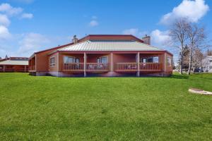 a large house with a large green lawn in front of it at Aspenwood 4229-30 in Pagosa Springs