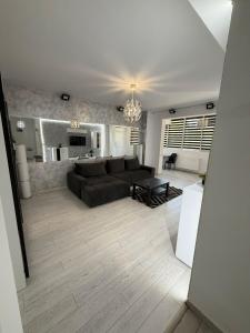 a living room with a couch and a table at RC RelaxApart 15 in Dudu