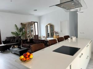 a living room with a white counter top in a room at Casa de la luz in Cartagena