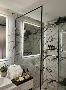a bathroom with a shower and a sink at Blue Pyramids Eyes Hotel in Cairo
