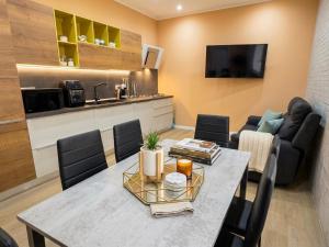 a living room with a table and a couch at Costa Ovest Apartment 3 in Nurachi
