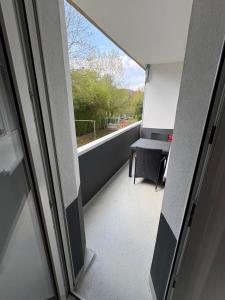 a view of a balcony with a table and a window at Rethmann Monteurwohnung Ferienwohung in Georgsmarienhütte