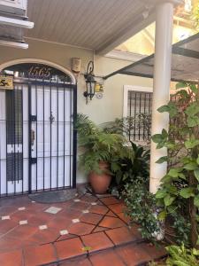 a front door of a house with plants at Comfort Suite in Vicente López