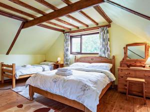 a bedroom with two beds and a mirror at 2 Bed in Spalding oc-83540 in Donington