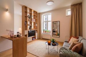 a living room with a couch and a table at Villa Šanca in Bratislava +53 photos