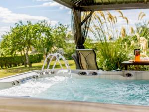a hot tub with water coming out of it at 5 Bed in Melrose oc-89348 in Newtown Saint Boswells
