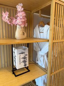 a wooden cage with a book and towels in it at The Suite Collection in Fuengirola +33 photos