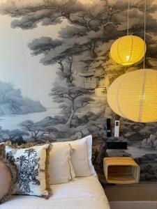 a living room with a couch and a wall mural at The Suite Collection in Fuengirola