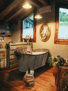 an old bath tub in a room with a sink at La Bottega del Drago in Santa Brigida +26 photos