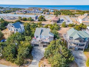 an aerial view of a home with the ocean in the background at Isle be sea'n you in Rodanthe