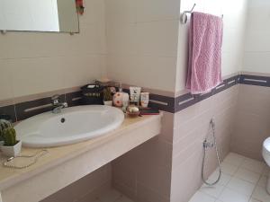 a bathroom with a sink and a toilet at Confort house in Nabeul +25 photos