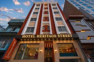 a hotel heritage street building with a sign on it at Hotel Heritage Street ! 100m from Golden Temple ! Parking & Restaurant in Amritsar