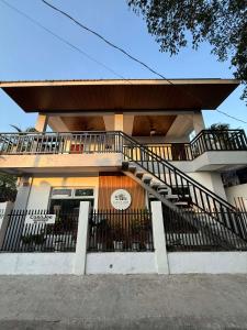 a house with a staircase in front of it at Tanauan Transient Casa Joe in Daraza
