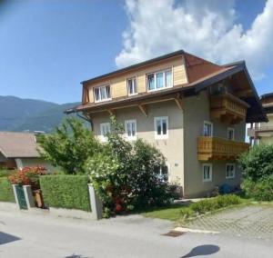a house with balconies on the side of it at Lovely Rita Studio, modern Studio - balcony and mountain view - center Kaprun in Kaprun