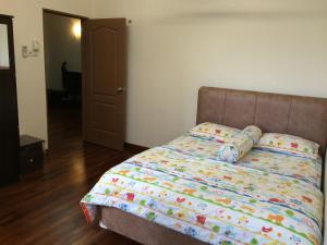 Postel nebo postele na pokoji v ubytování Putrajaya 1808 Homestay
