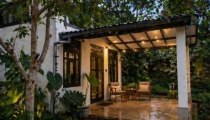 a pergola with a table and chairs on a patio at Ella Nature viwe Lodge in Ella