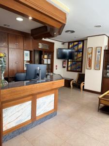 a lobby of a hospital with a reception desk at Hotel Vadorrey in Roa