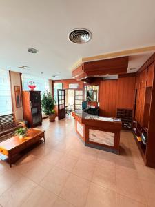 a large room with a table and benches in it at Hotel Vadorrey in Roa