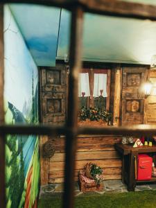 a view of a room with a painting on the wall at URBAN PIC NIC in Piazza Brembana