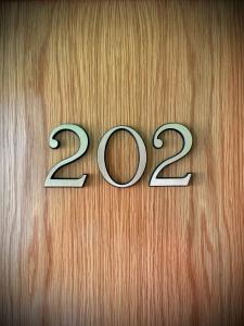 a wooden door with the number on it at Hotel Vadorrey in Roa +16 photos