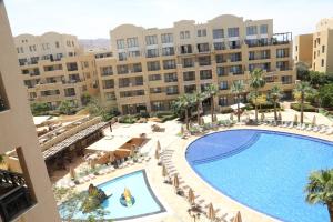 an overhead view of a swimming pool in a resort at Samarah Resort Apartment D32 at DeadSea, Sea & Pool view- Families & couples only in Sowayma