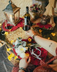 a table with two people holding glasses of wine at Il Roccolino in Valsecca