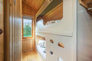 a tiny house with a staircase in the middle at 1 Bed in Barnacre oc-b34348 in Catterall
