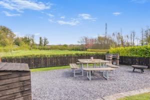 a patio with a table and chairs and a fence at 1 Bed in Barnacre oc-b34348 in Catterall +8 photos
