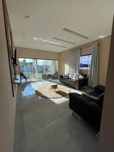 a living room with a couch and a table at WS Hotel in Campo Alegre