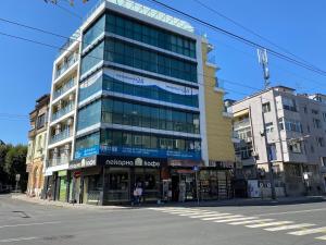 a tall building on the corner of a street at KiShouse in Burgas +7 photos