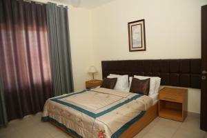 a bedroom with a large bed in a room at Apartment Samarah Resort D44 at DeadSea, Sea & Pool view-Families & couples only in Sowayma +90 photos