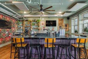 a bar in a restaurant with four bar stools at Southern Blue in McMinnville