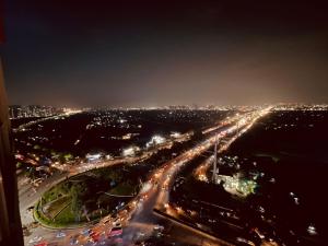 a city lit up at night with traffic at Sukoon studios in Ghaziabad