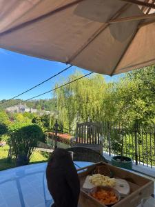 a plate of food on a table under an umbrella at L'Alterre Durbuy in Durbuy