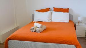 a bedroom with a bed with two towels on it at Villa Azur Horizon in La Turbie +16 photos