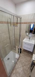 a bathroom with a shower and a sink at O.W. LAZUR nad jeziorem in Żywiec +55 photos