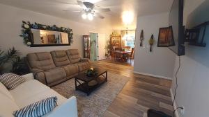 a living room with a couch and a table at By Summersville Lake 3BR Jetted Tub Sauna in Craigsville