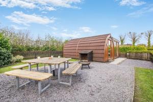 a backyard with a picnic table and a dome shaped building at 1 Bed in Barnacre oc-b34349 in Catterall