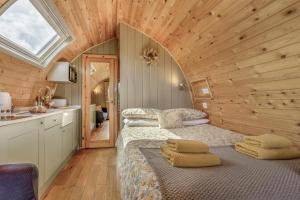 a bedroom with a bed in a wooden room at 1 Bed in Barnacre oc-w34347 in Catterall