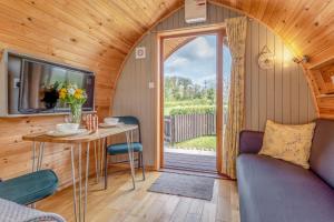 a small dining room with a table and a window at 1 Bed in Barnacre oc-w34347 in Catterall