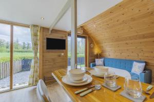 a dining room with a table and a large window at 1 Bed in Barnacre oc-b34349 in Catterall