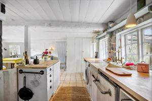 a kitchen with a white stove and a sink at AE326-Marstal-Pers-Bro-6 in Marstal