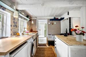 a kitchen with a washer and dryer in it at AE326-Marstal-Pers-Bro-6 in Marstal +16 photos