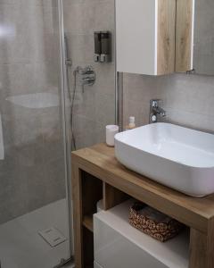 a bathroom with a white sink and a shower at Casa Vacanze Palidoro Il Plumbaco in Palidoro +54 photos