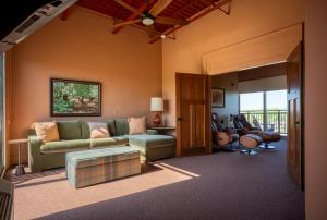 a living room with a couch and a table at Hotel Broad Ripple in Indianapolis