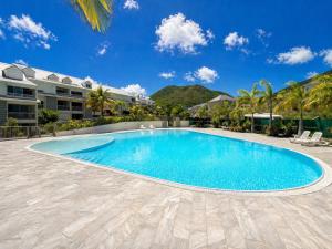 a swimming pool in the middle of a resort at Casa Soleil Vibrant Caribbean Hideaway, Perfect for families & friends in Cul de Sac