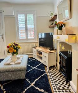 a living room with a desk and a couch at 31 Sailsbury road in Marlborough
