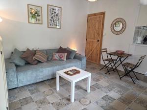 a living room with a couch and a table at Kellaki Village House in Kellaki