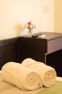 a towel laying on the floor in a hotel room at Bacanda Hotel in Puerto Escondido +152 photos
