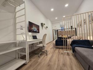 a room with a desk and a bed and a bedroom at Loft Centrico Tantín RH 17 in Santander